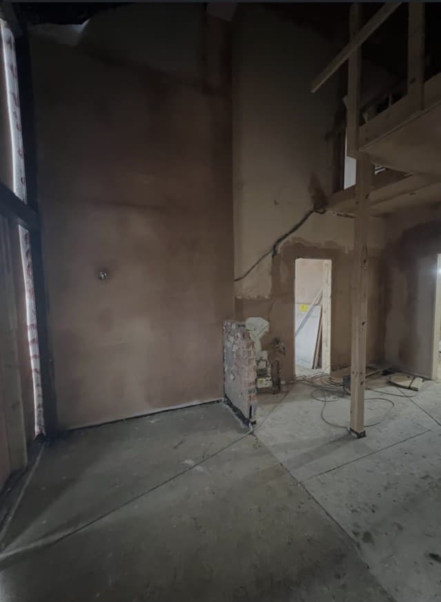 Entrance hallway during renovation before the bespoke staircase and finished interior were installed.