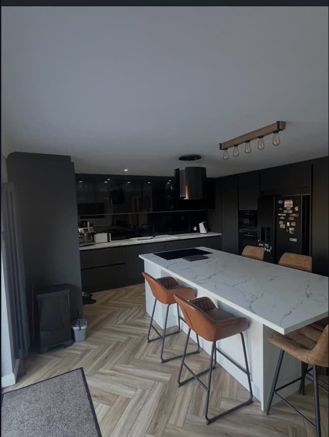 Alternative wide view of the bespoke anthracite kitchen and Calacatta marble island.