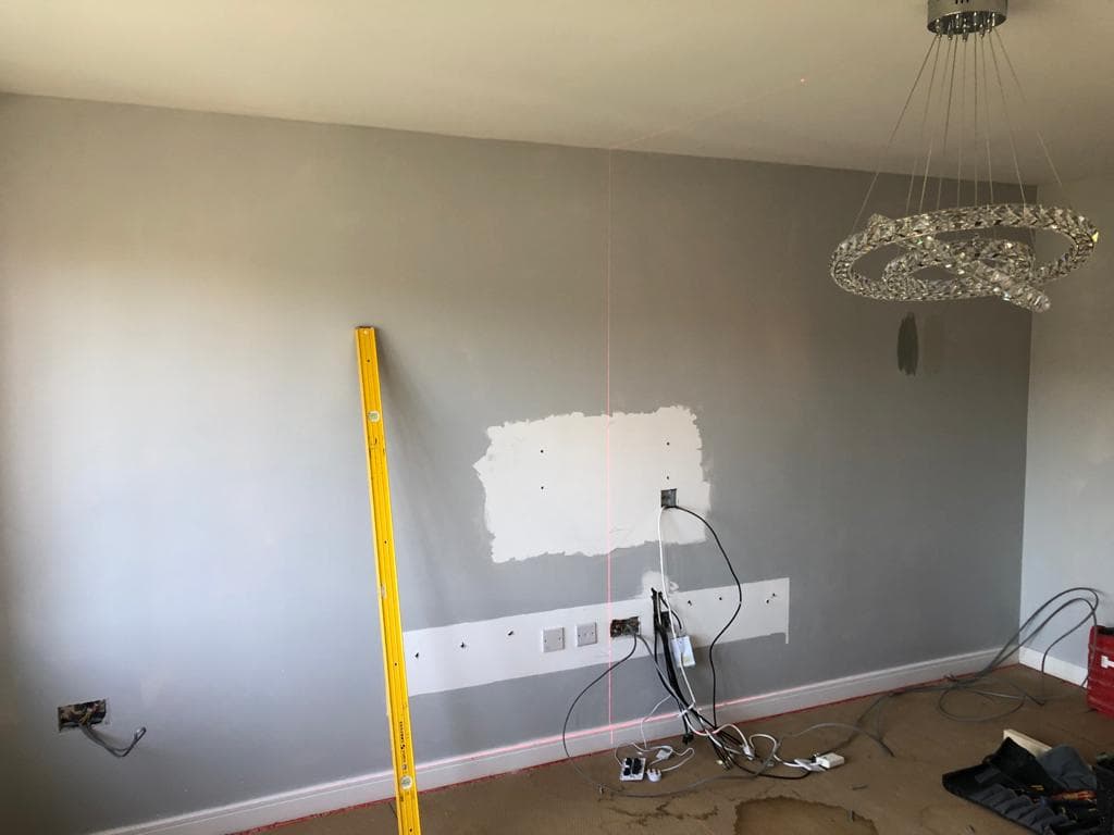 Grey panelled television wall.
