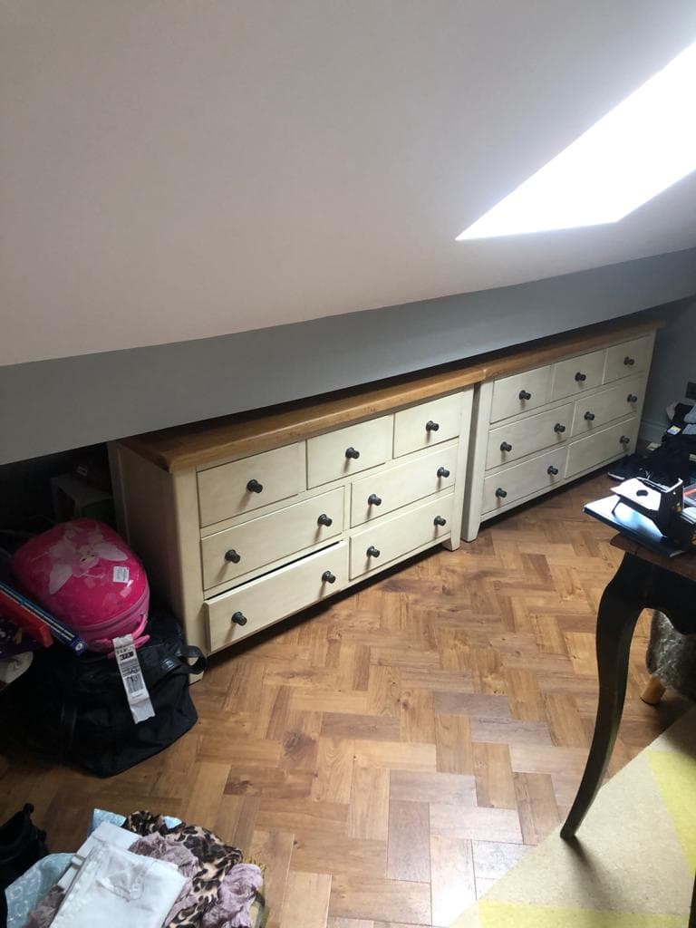 Bespoke wardrobe installation in a loft room.