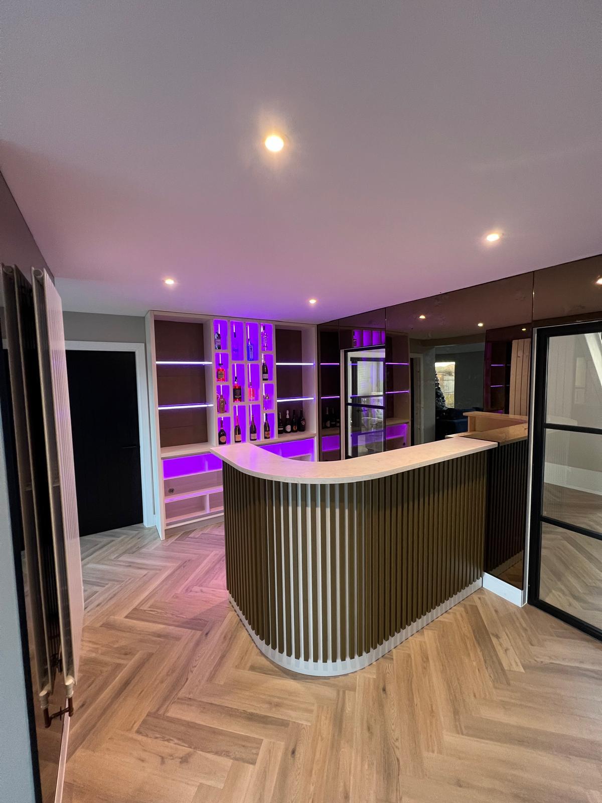 Detailed view of the home bar's reeded front and worktop.