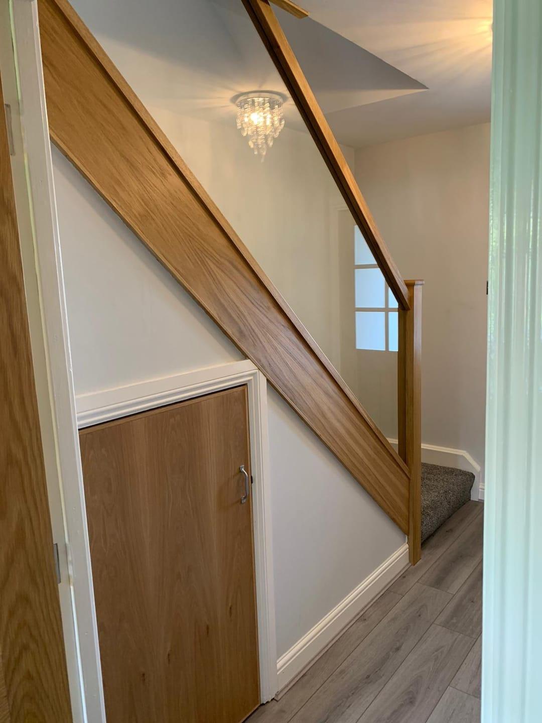 Oak and glass staircase with clear balustrade.